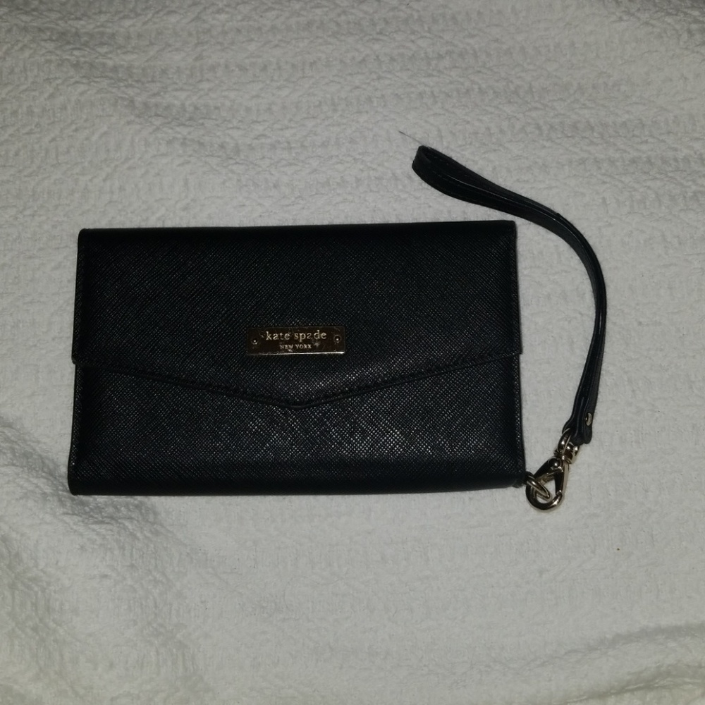 Black, gently used wristlet. Fits iPhone 6/7 plus